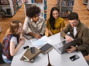 Group of students working together in the library