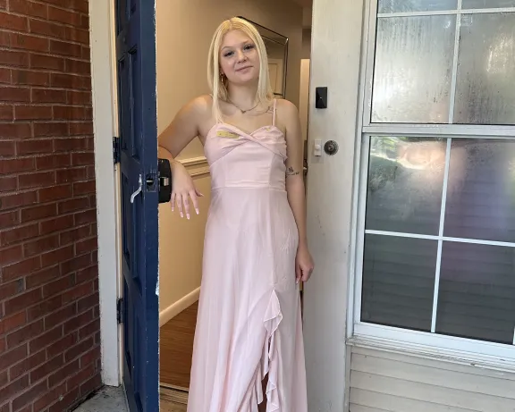 Photo of woman standing in a doorway