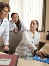 Women researchers looking at computer screen