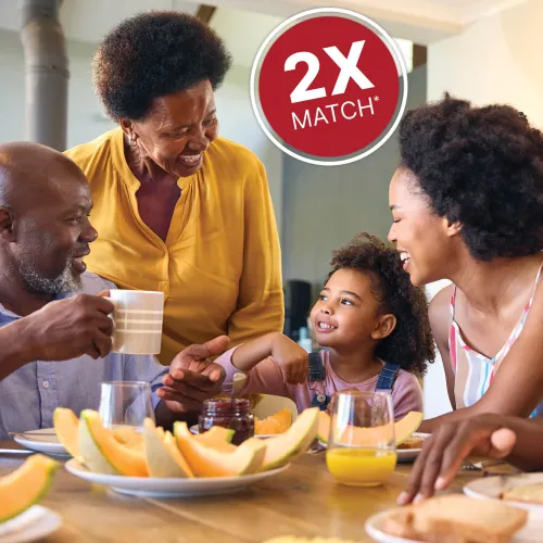 Smiling family eating a healthy breakfast